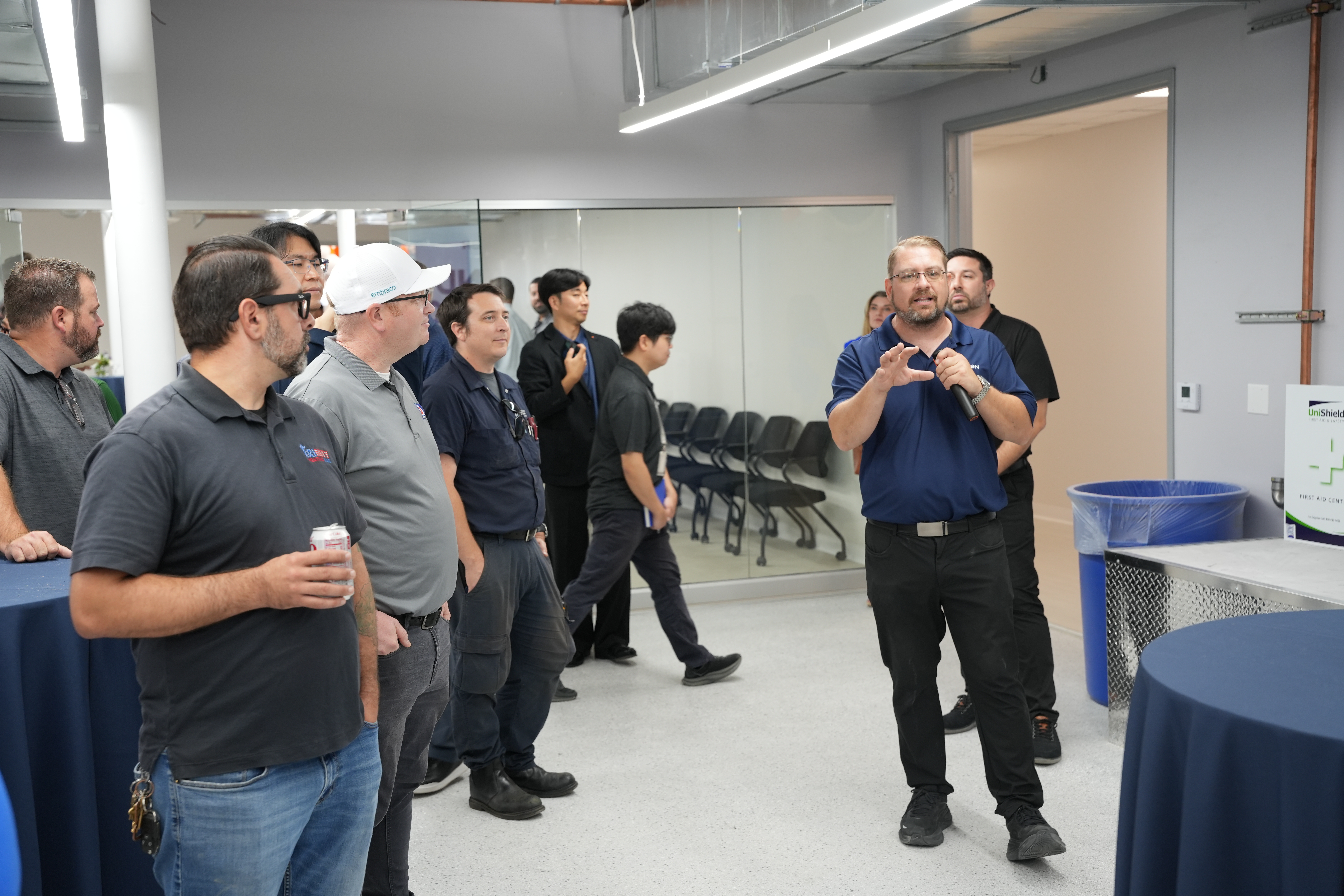 Guests participate in a guided walkthrough of Navien's Innovation Center and Training Academy during the Irvine grand opening event